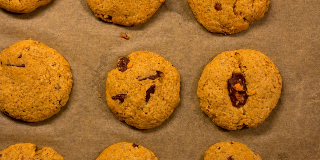 a bunch of cookies sitting on top of a baking sheet